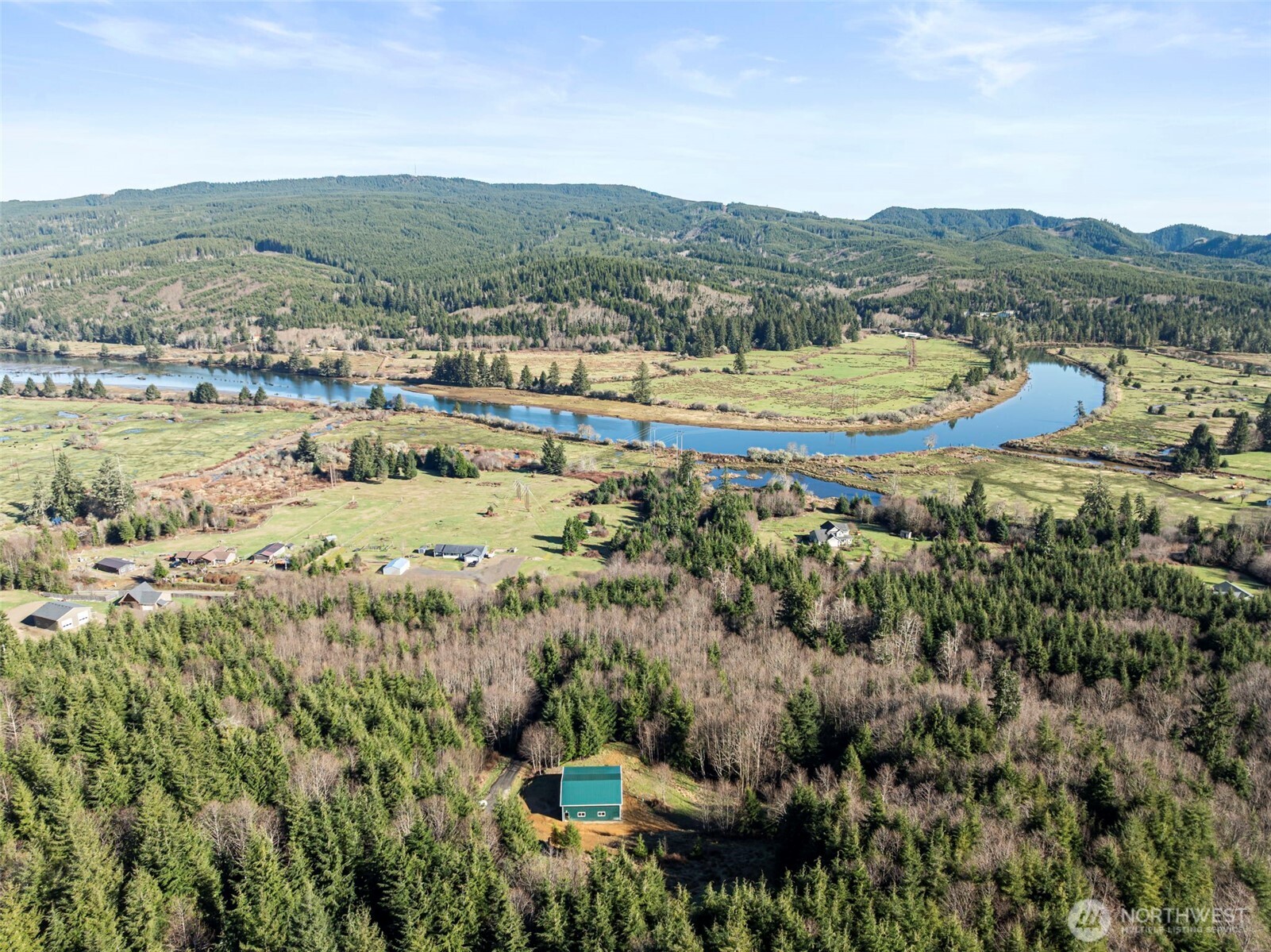341 Parpala Road Naselle, WA 98638 - Photo 5 of 22 a view of a city with mountains in the background