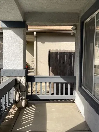 a view of a porch with wooden floor