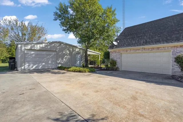 a view of a house with a yard and garage