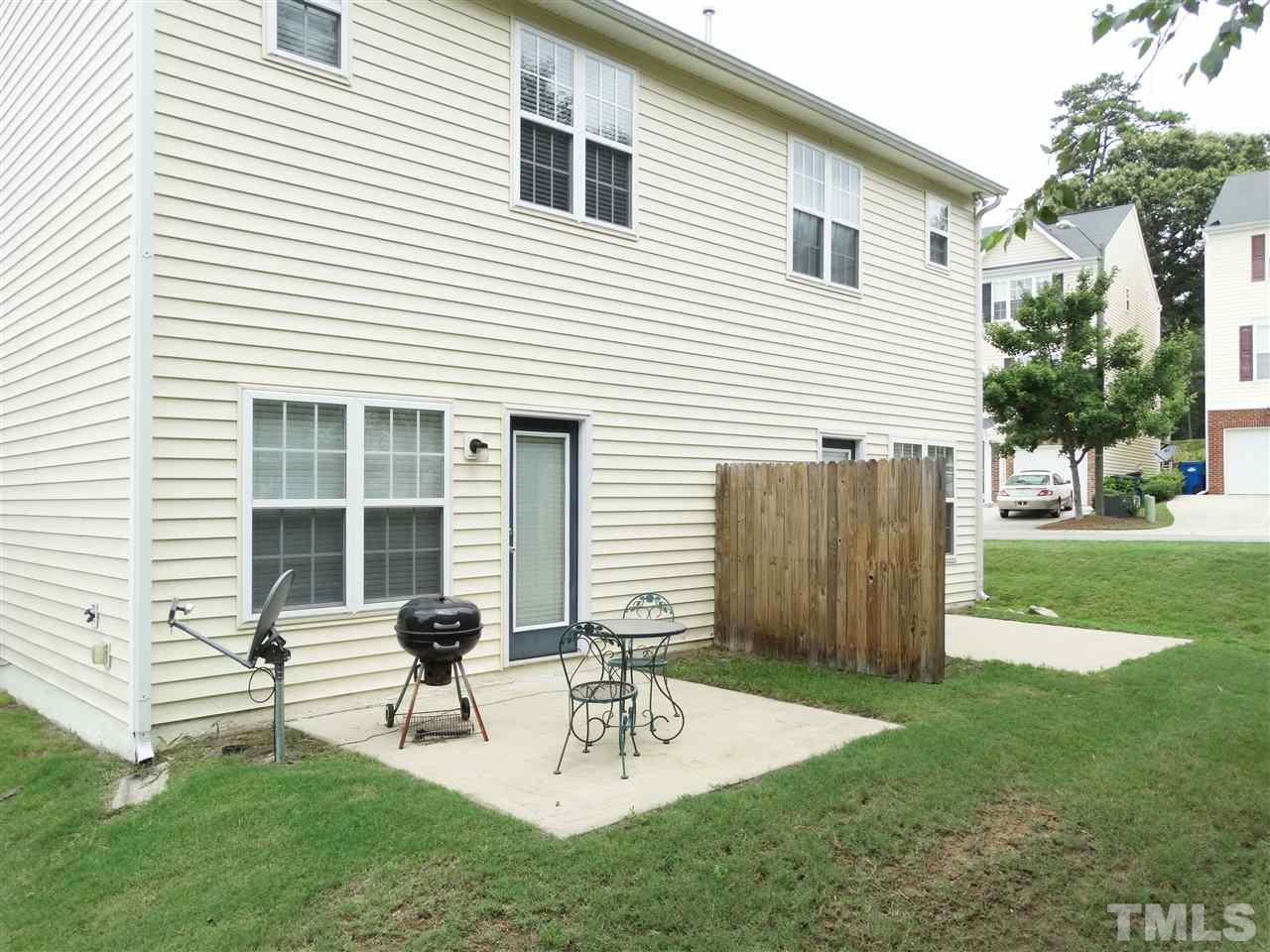 2166 Metacomet Way Raleigh, NC 27604 - Photo 22 of 25 a view of house with backyard and a patio