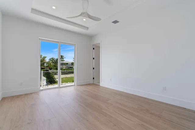 wooden floor in a hall with an empty room