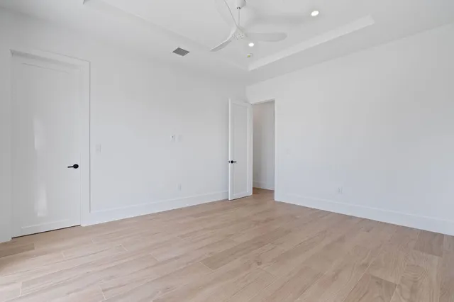 a living room with furniture potted plant and a large window