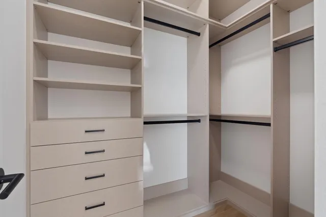 a view of a kitchen with a sink and a large window