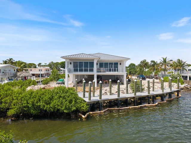 a view of a lake with a house in the background