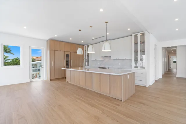 a view of a kitchen with a stove cabinets and a wooden floor