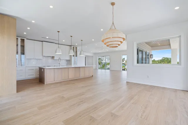 an aerial view of a house a yard and a swimming pool
