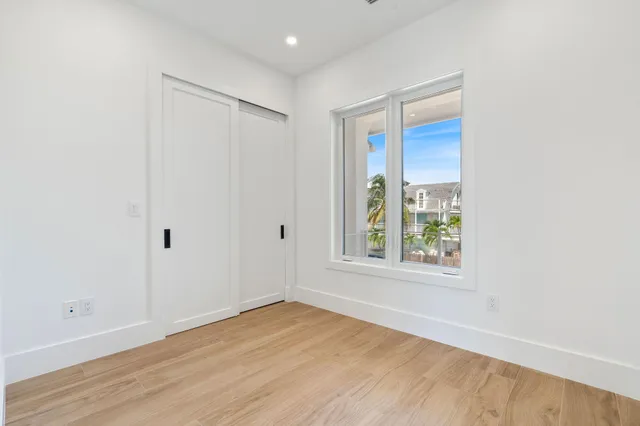 an aerial view of a house with a swimming pool
