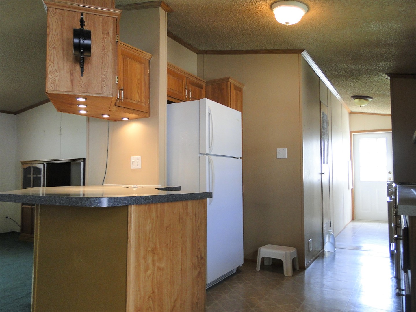 26 Maple Street Minooka, IL 60447 - Photo 4 of 13 a kitchen with stainless steel appliances a refrigerator and a stove top oven