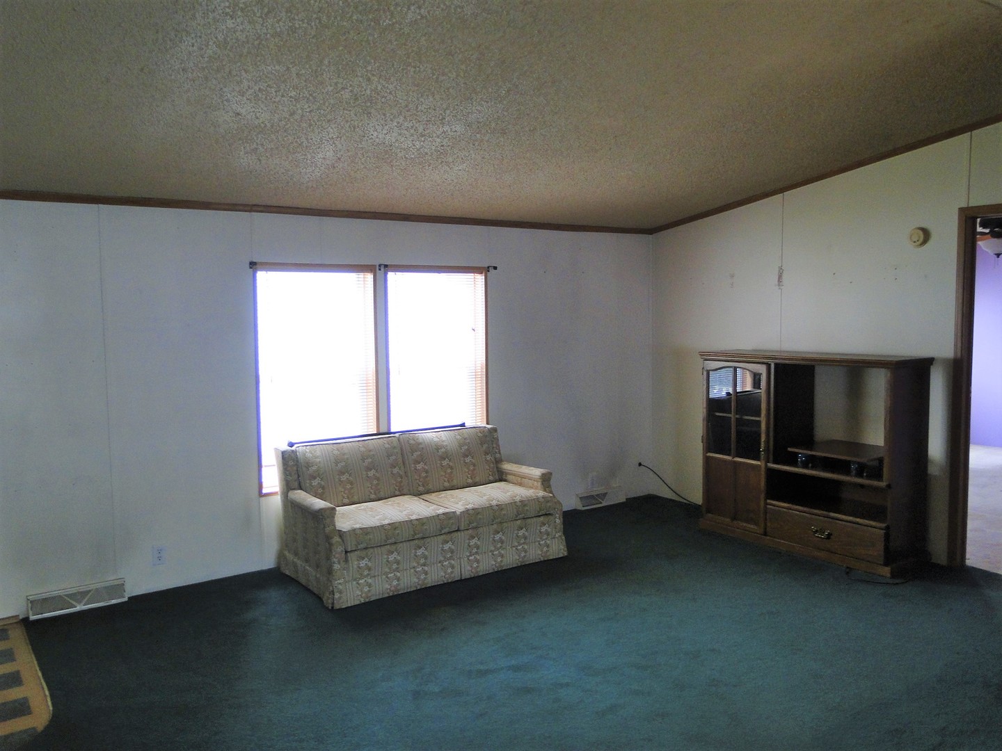 26 Maple Street Minooka, IL 60447 - Photo 7 of 13 a living room with furniture and a flat screen tv