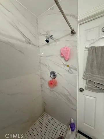 a bathroom with a sink and a shower