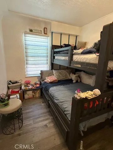 a bedroom with furniture and a window