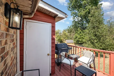 a view of chair in wooden deck