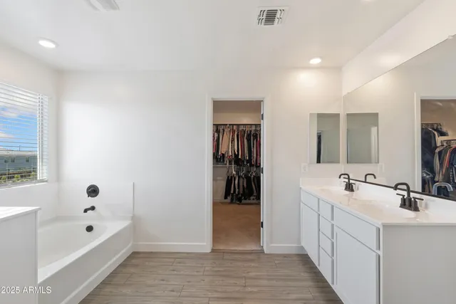 a bedroom with a bed and a chair