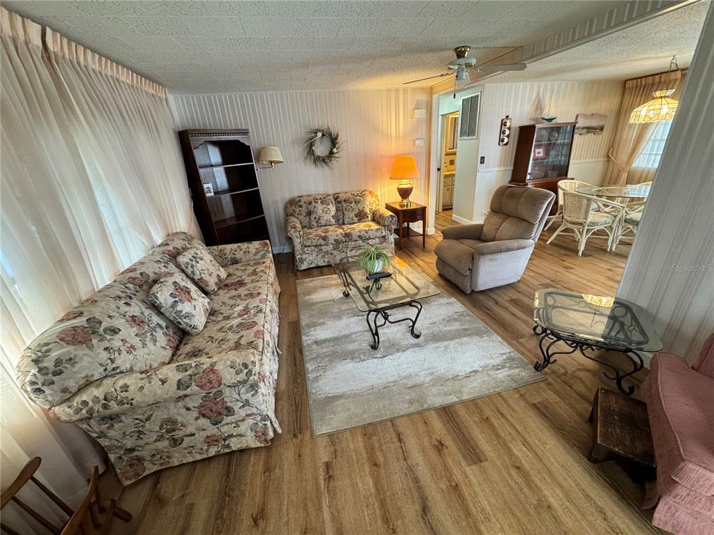 2331 Belleair Road, Unit 804 Clearwater, FL 33764 - Photo 13 of 37 a living room with furniture and a wooden floor