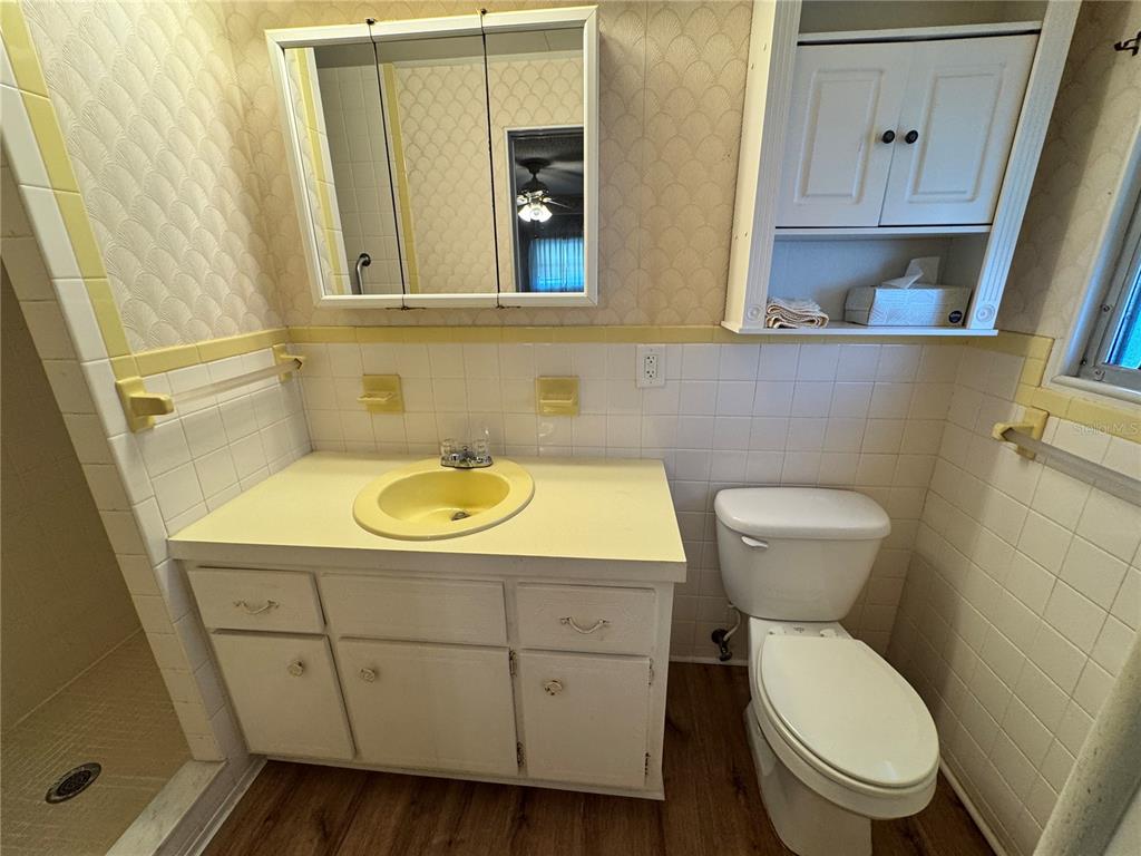 2331 Belleair Road, Unit 804 Clearwater, FL 33764 - Photo 18 of 37 a bathroom with a toilet a sink and a mirror