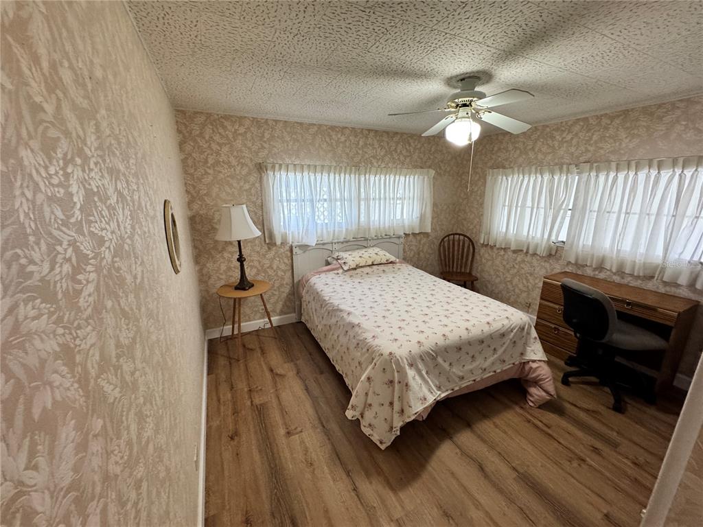 2331 Belleair Road, Unit 804 Clearwater, FL 33764 - Photo 20 of 37 a bedroom with a bed a fireplace and a window