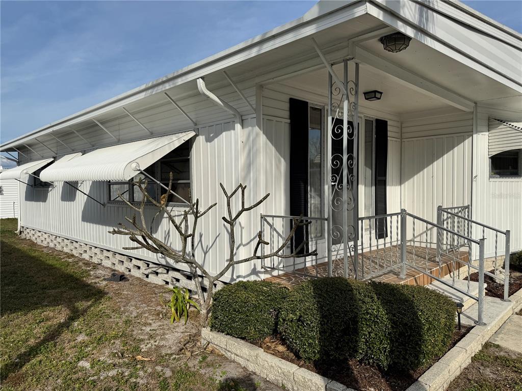 2331 Belleair Road, Unit 804 Clearwater, FL 33764 - Photo 2 of 37 a front view of a house with garden