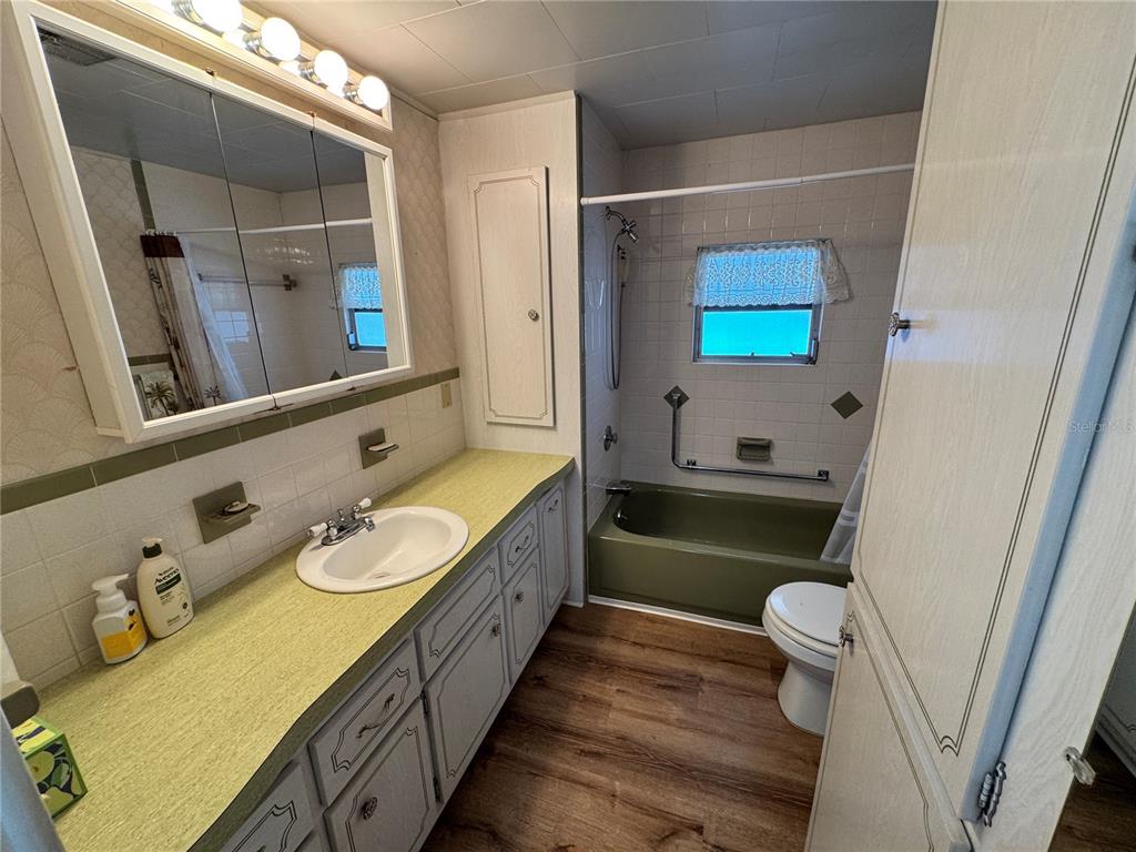2331 Belleair Road, Unit 804 Clearwater, FL 33764 - Photo 22 of 37 a bathroom with a granite countertop sink mirror vanity and toilet