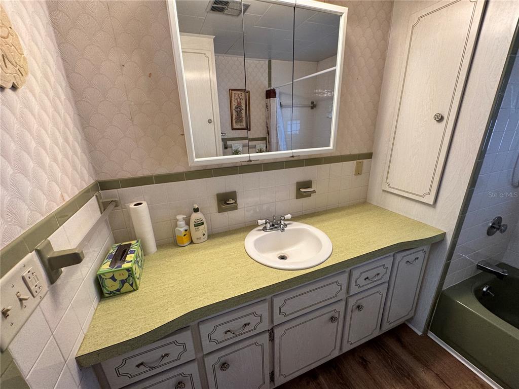 2331 Belleair Road, Unit 804 Clearwater, FL 33764 - Photo 25 of 37 a bathroom with a granite countertop sink and a mirror