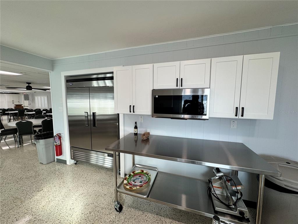 2331 Belleair Road, Unit 804 Clearwater, FL 33764 - Photo 34 of 37 a kitchen with stainless steel appliances granite countertop a refrigerator and a stove
