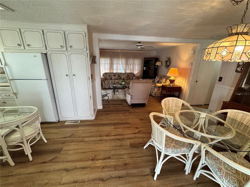 2331 Belleair Road, Unit 804 Clearwater, FL 33764 - Photo 5 of 37 a dining room with furniture and wooden floor