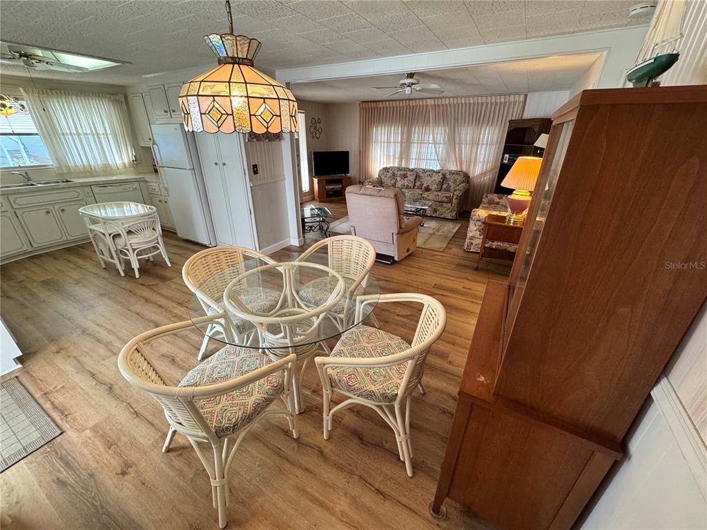 2331 Belleair Road, Unit 804 Clearwater, FL 33764 - Photo 10 of 37 a view of a livingroom with furniture wooden floor and chandelier