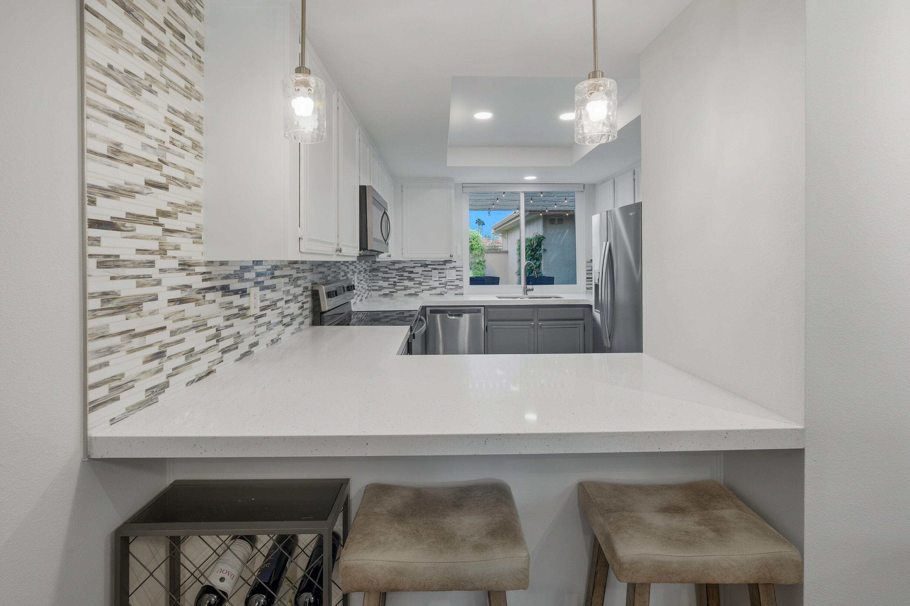 24 Palma Drive Rancho Mirage, CA 92270 - Photo 13 of 40 a view of kitchen with kitchen island a sink and a stove with wooden floor