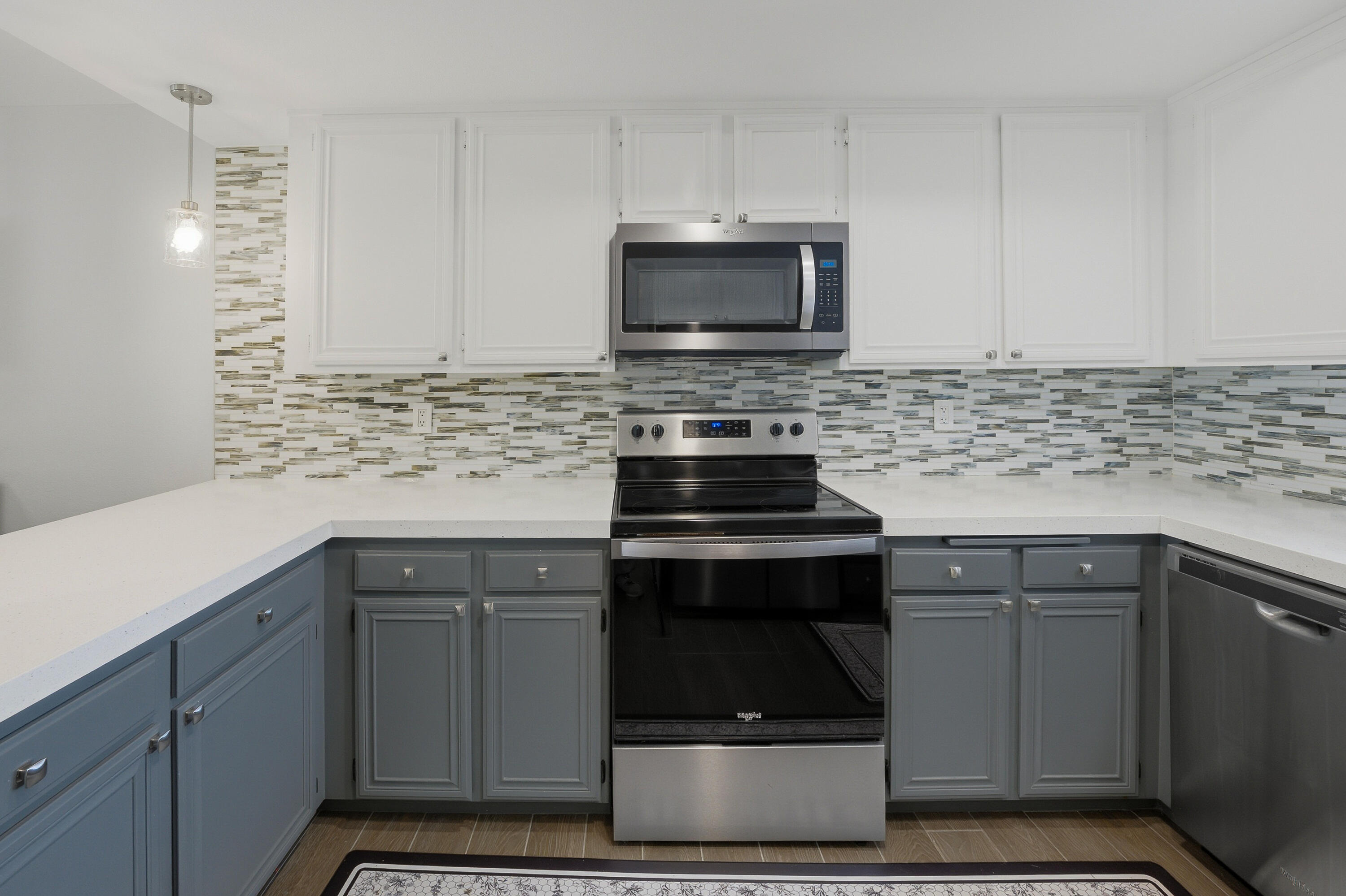 24 Palma Drive Rancho Mirage, CA 92270 - Photo 17 of 40 a kitchen with stainless steel appliances a stove a sink and a microwave