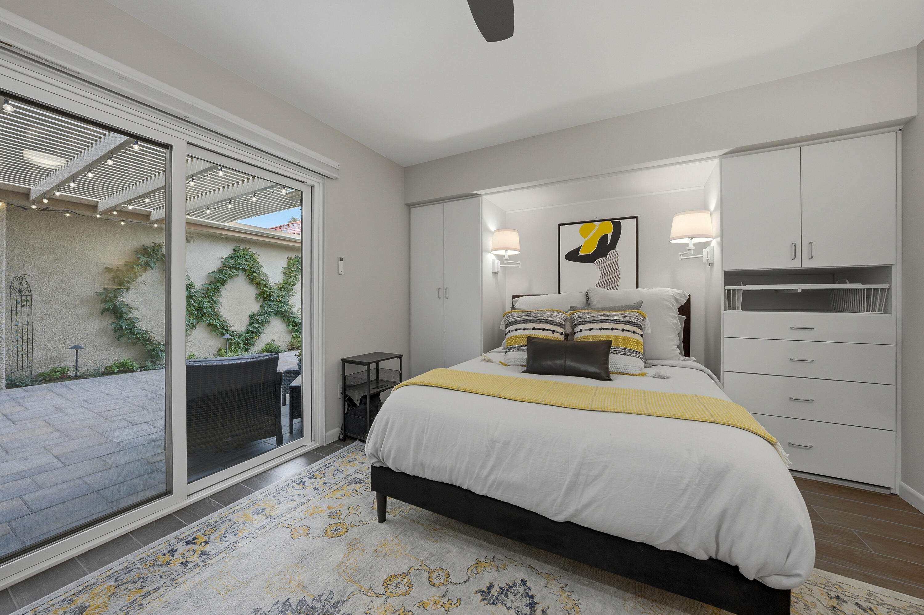 24 Palma Drive Rancho Mirage, CA 92270 - Photo 18 of 40 a bedroom with a bed and a window with the outer view