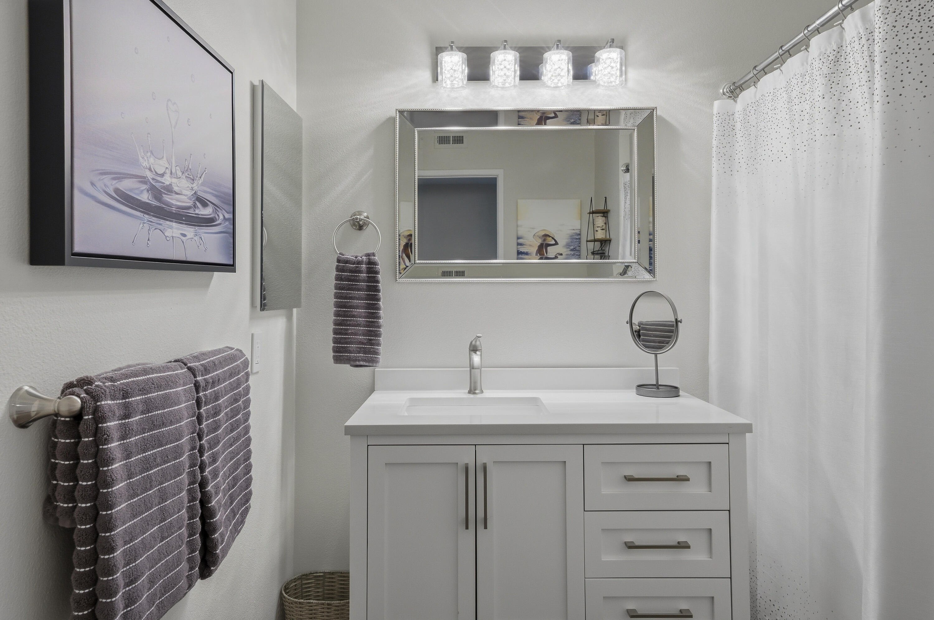24 Palma Drive Rancho Mirage, CA 92270 - Photo 20 of 40 a bathroom with a sink vanity and mirror