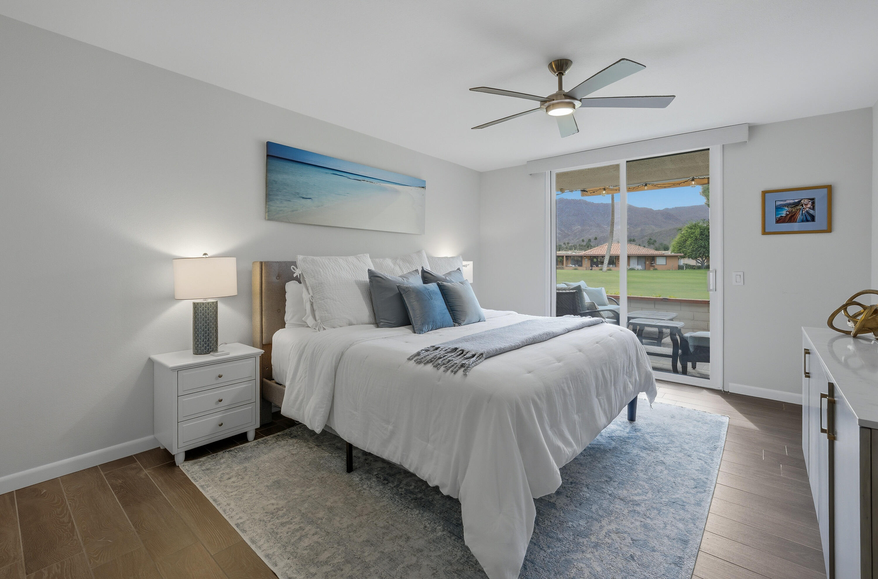 24 Palma Drive Rancho Mirage, CA 92270 - Photo 21 of 40 a bedroom with a bed and a large window