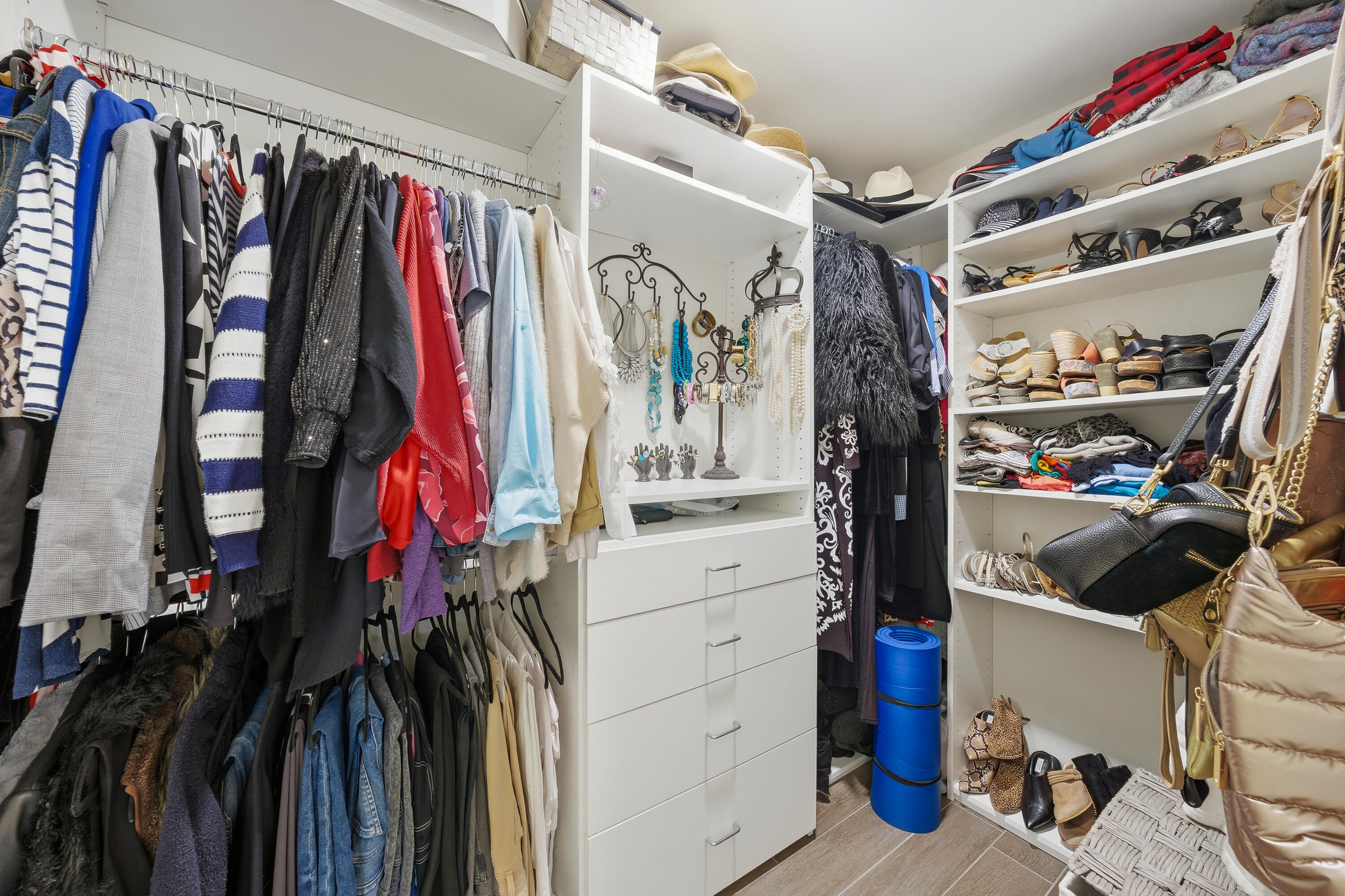 24 Palma Drive Rancho Mirage, CA 92270 - Photo 25 of 40 a view of walk in closet with clothes and shoes