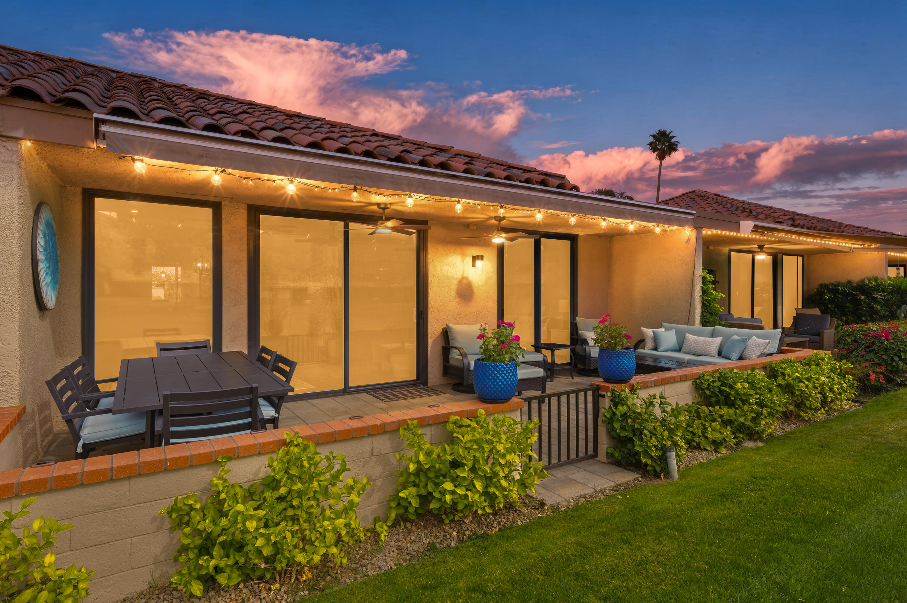 24 Palma Drive Rancho Mirage, CA 92270 - Photo 35 of 40 a living room with patio furniture and a potted plants