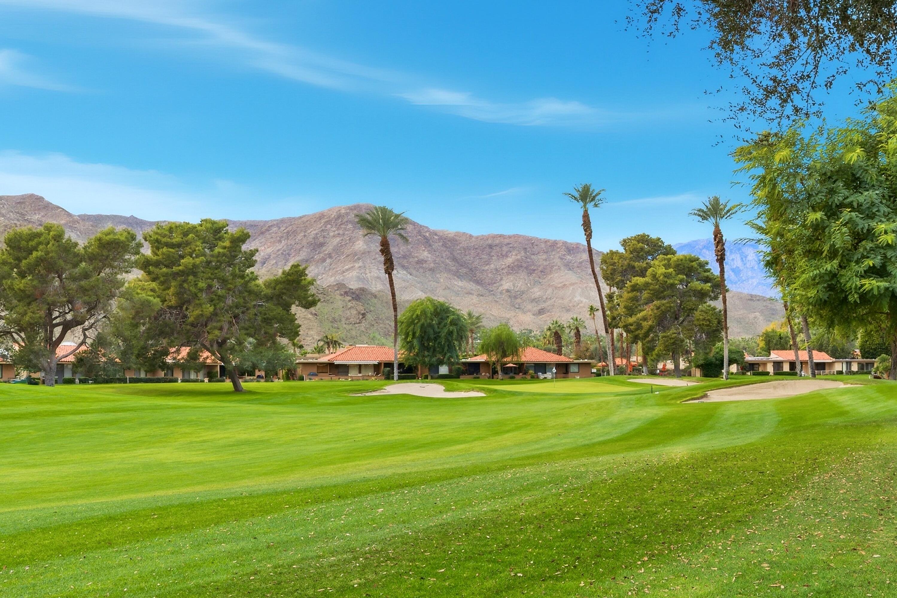 24 Palma Drive Rancho Mirage, CA 92270 - Photo 4 of 40 a view of a golf course with a lake