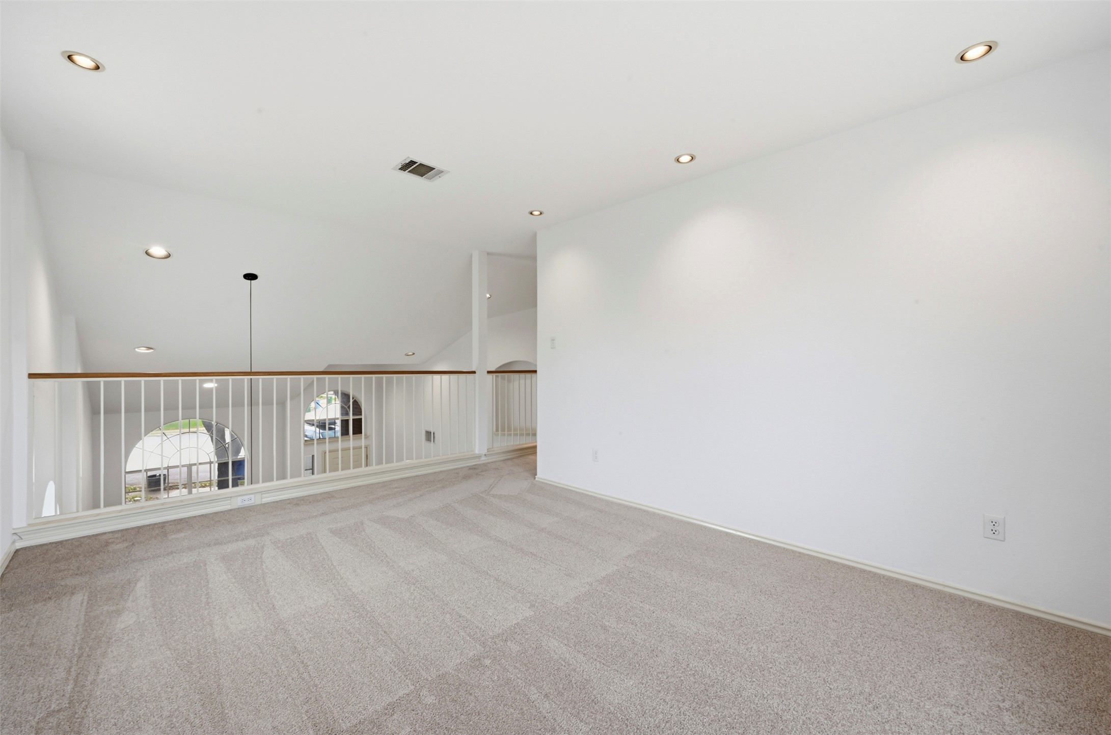 3629 Ruby Red Drive Austin, TX 78728 - Photo 23 of 35 Loft (from other perspective) open to living area (and entrance) below with ample natural light and recessed lighting