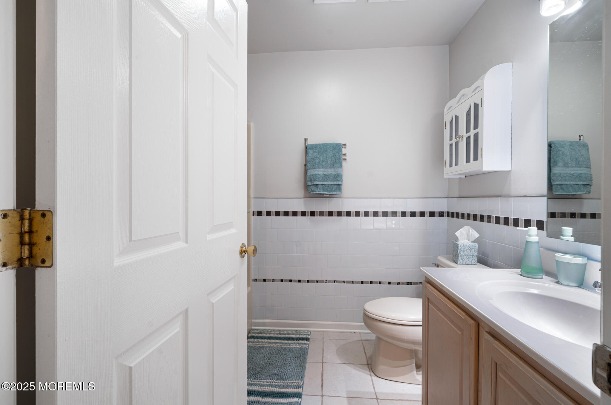 33 Sumner Avenue, Unit 5B RENTAL Seaside Heights, NJ 08751 - Photo 16 of 37 a bathroom with a toilet a sink and a window