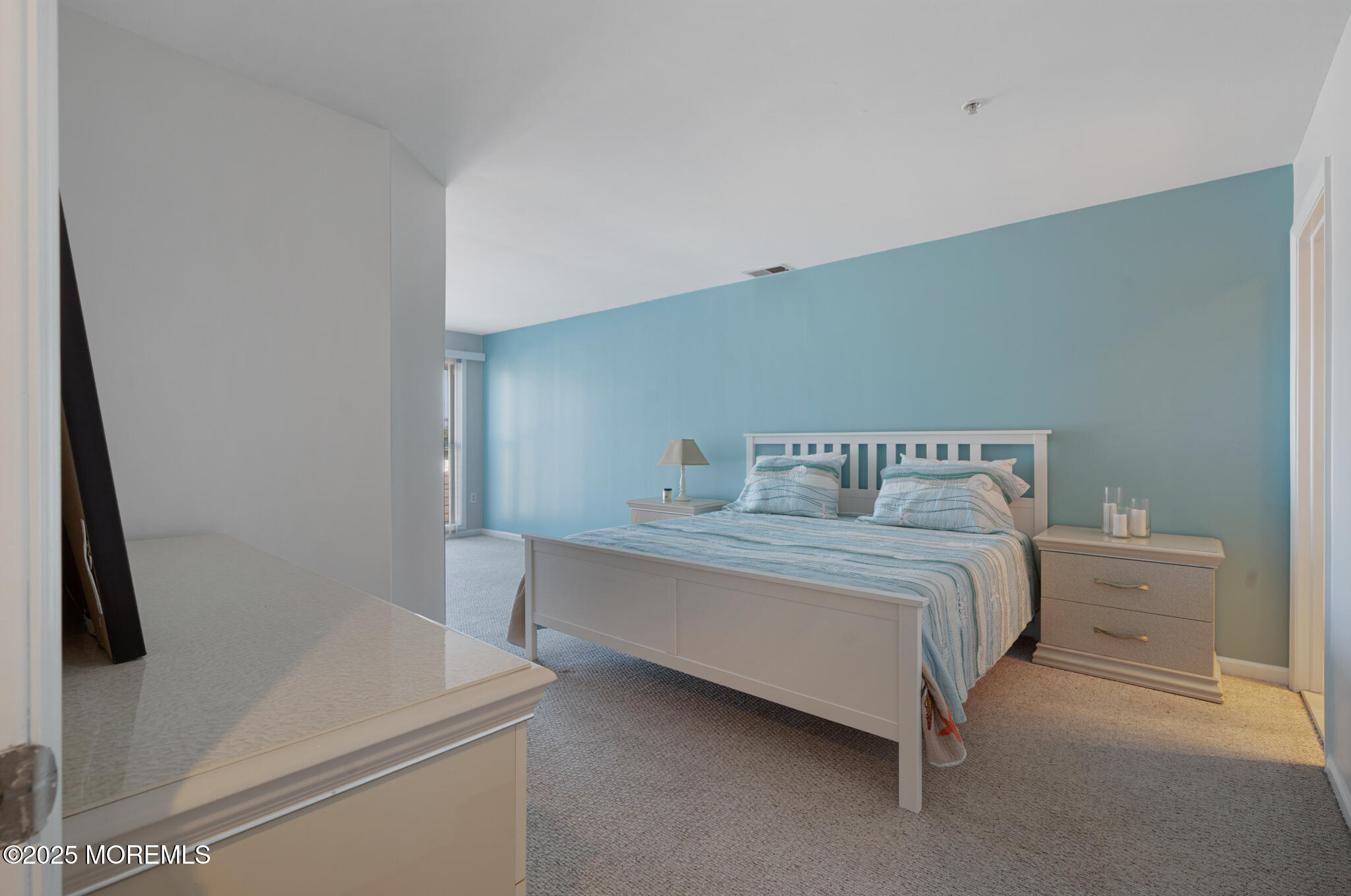 33 Sumner Avenue, Unit 5B RENTAL Seaside Heights, NJ 08751 - Photo 17 of 37 a bedroom with a bed and a mirror