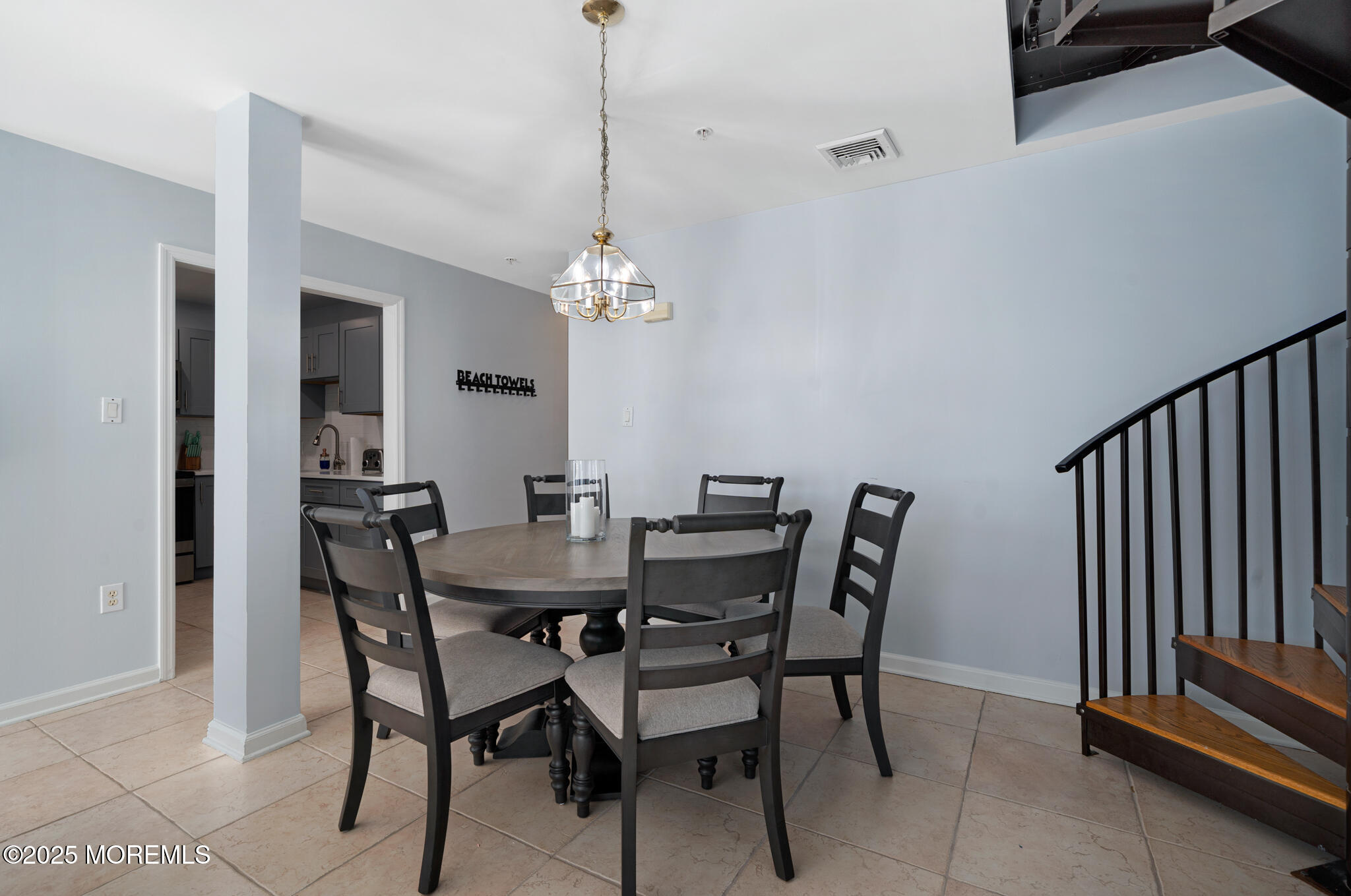 33 Sumner Avenue, Unit 5B RENTAL Seaside Heights, NJ 08751 - Photo 20 of 37 a view of a dining room with furniture and chandelier