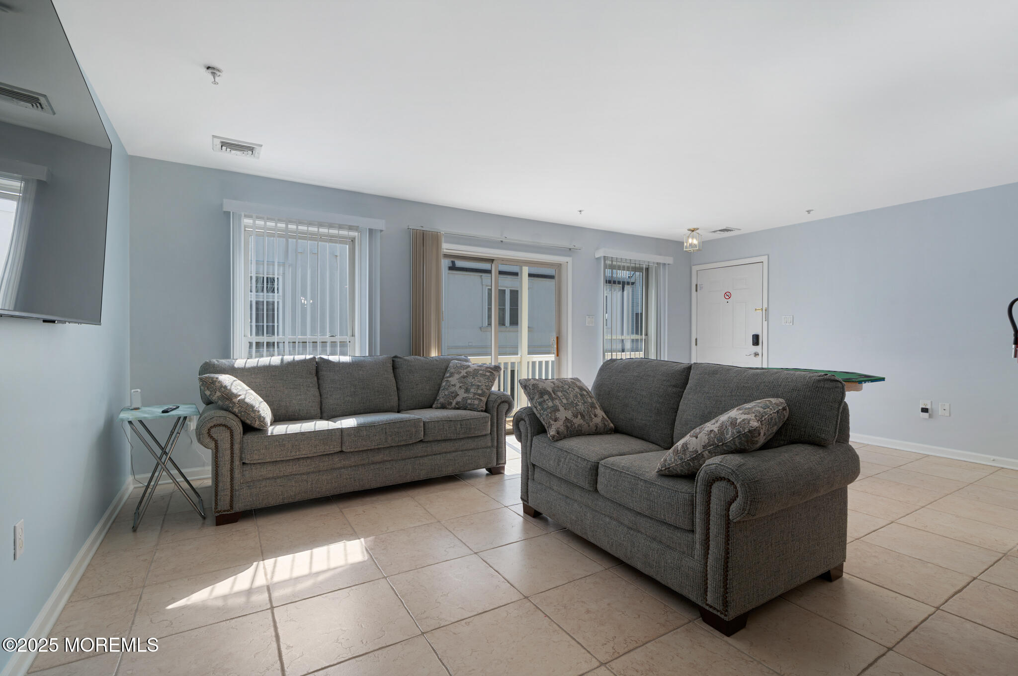 33 Sumner Avenue, Unit 5B RENTAL Seaside Heights, NJ 08751 - Photo 23 of 37 a living room with furniture and a couch