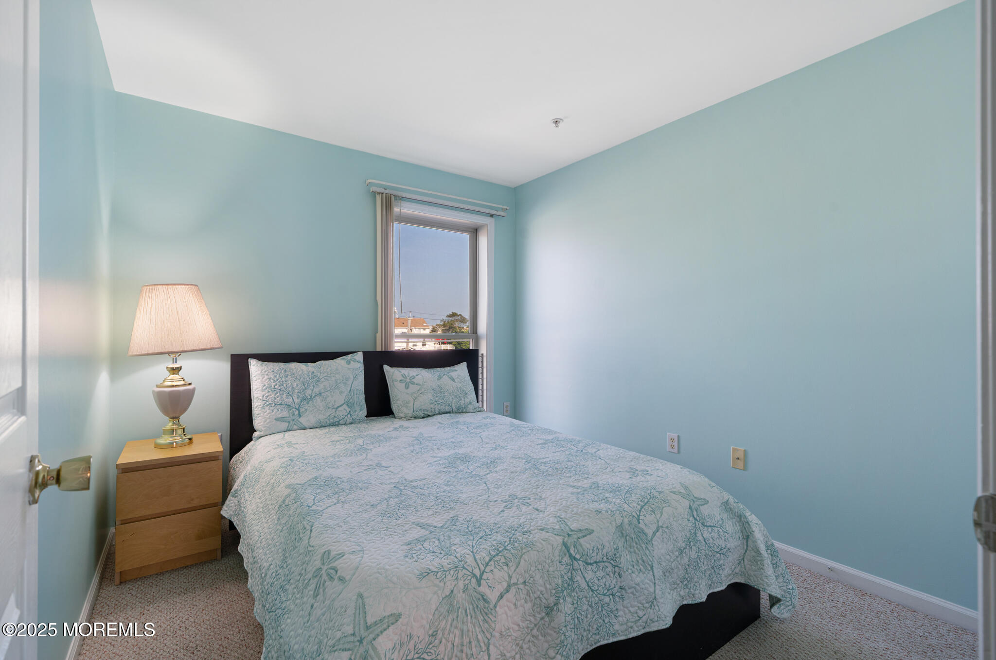 33 Sumner Avenue, Unit 5B RENTAL Seaside Heights, NJ 08751 - Photo 24 of 37 a bedroom with a bed and a lamp