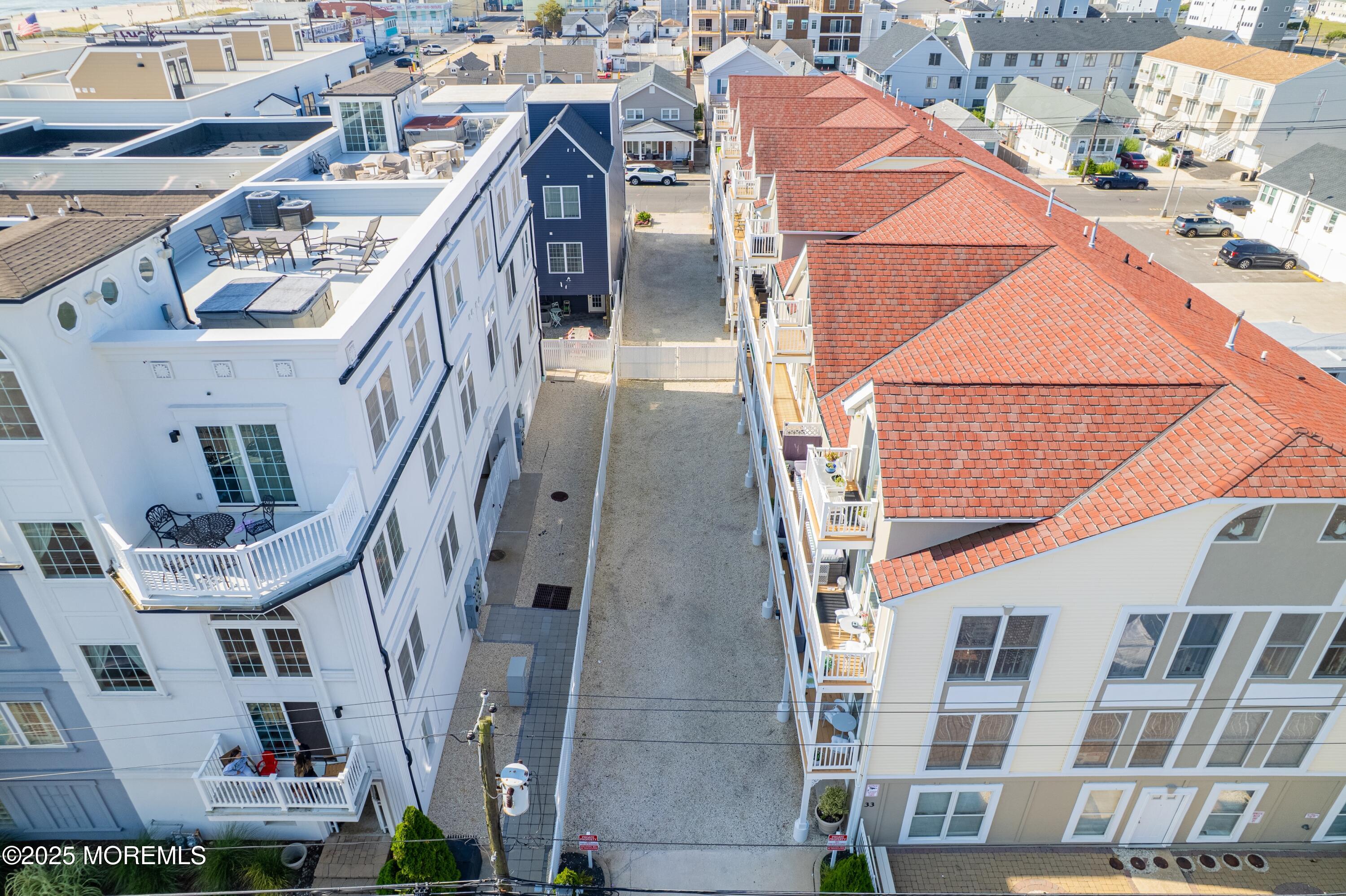 33 Sumner Avenue, Unit 5B RENTAL Seaside Heights, NJ 08751 - Photo 5 of 37 a view of a buildings with many windows