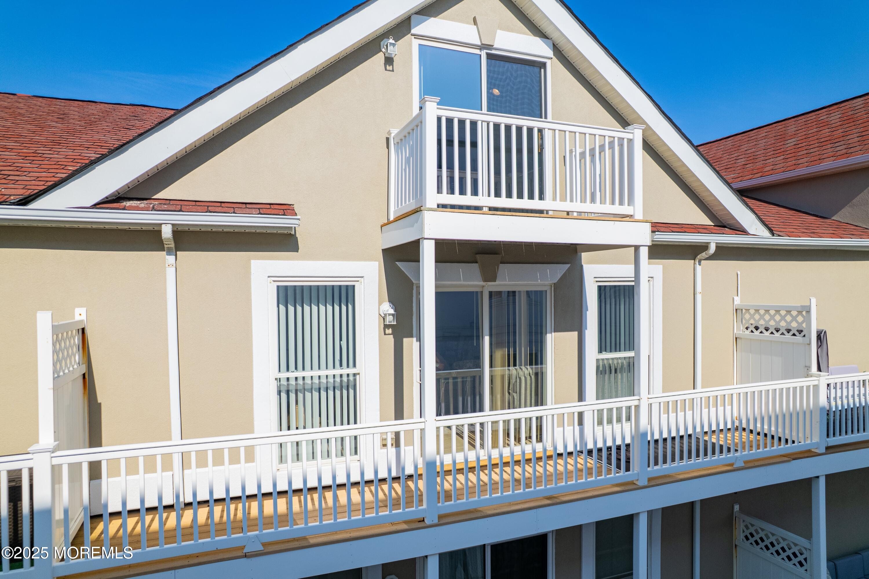 33 Sumner Avenue, Unit 5B RENTAL Seaside Heights, NJ 08751 - Photo 10 of 37 a view of a house with wooden deck