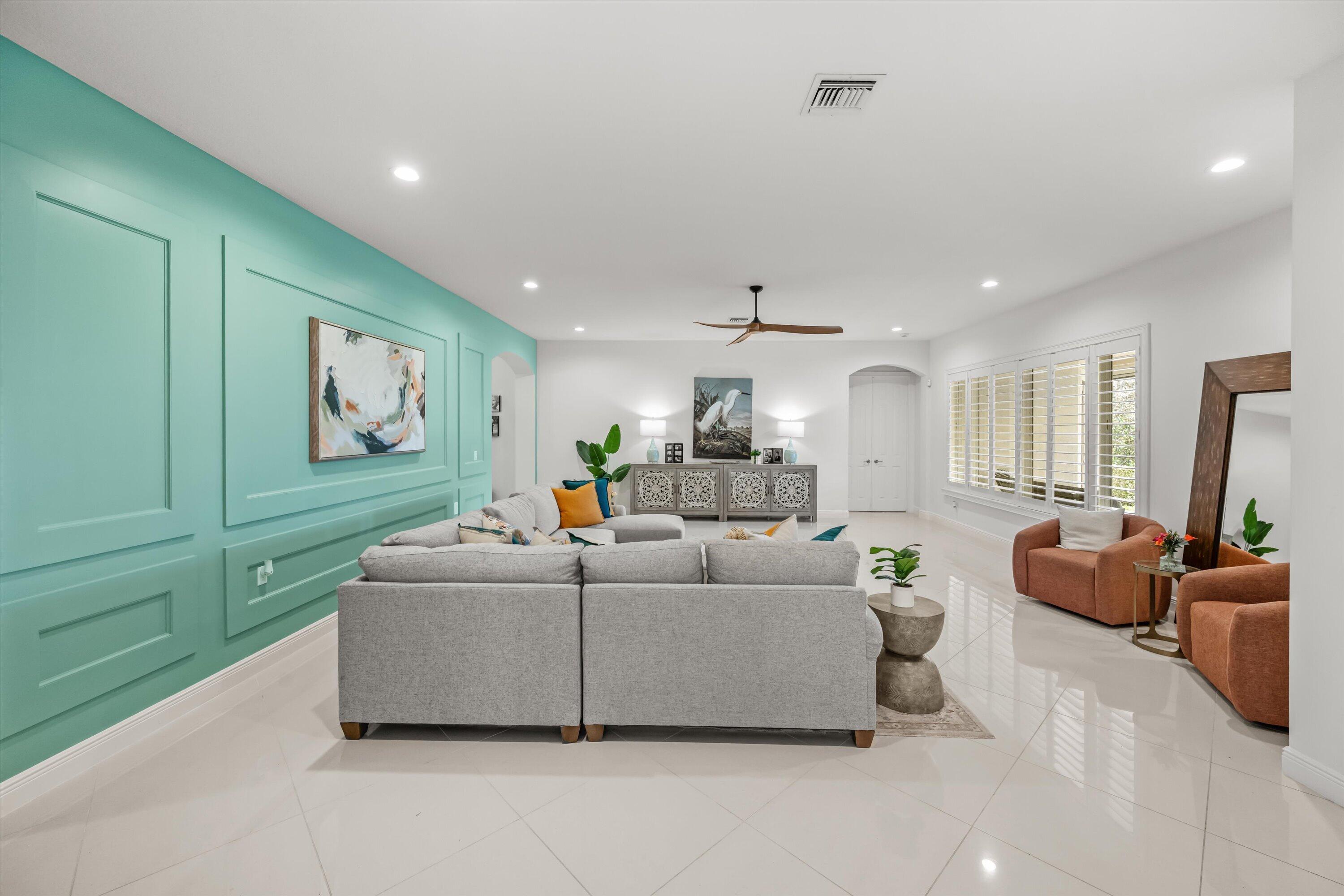 108 Casa Circle Jupiter, FL 33458 - Photo 8 of 53 a living room with furniture and a flat screen tv