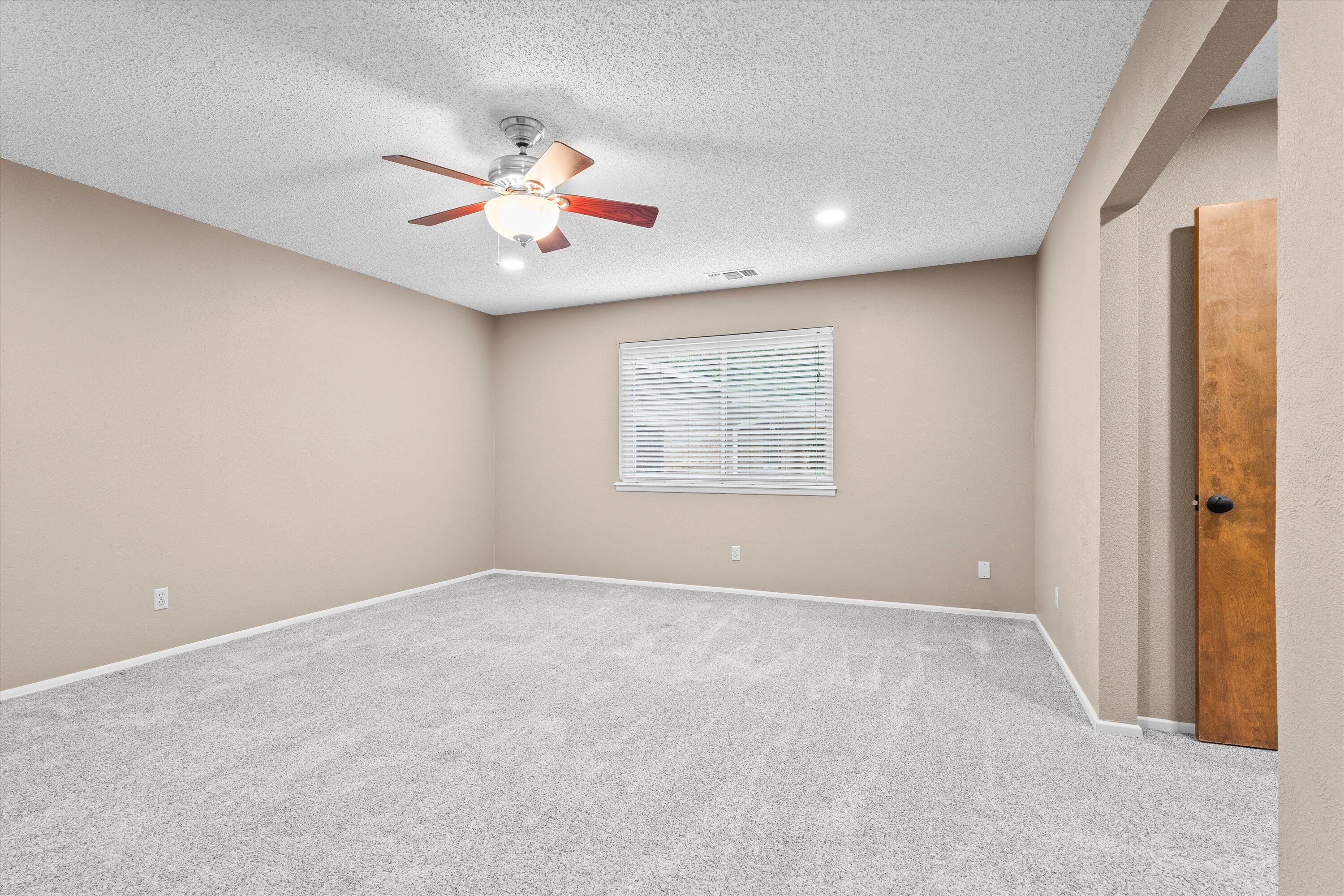 103 Baylor Lane Levelland, TX 79336 - Photo 17 of 27 a view of an empty room with a window