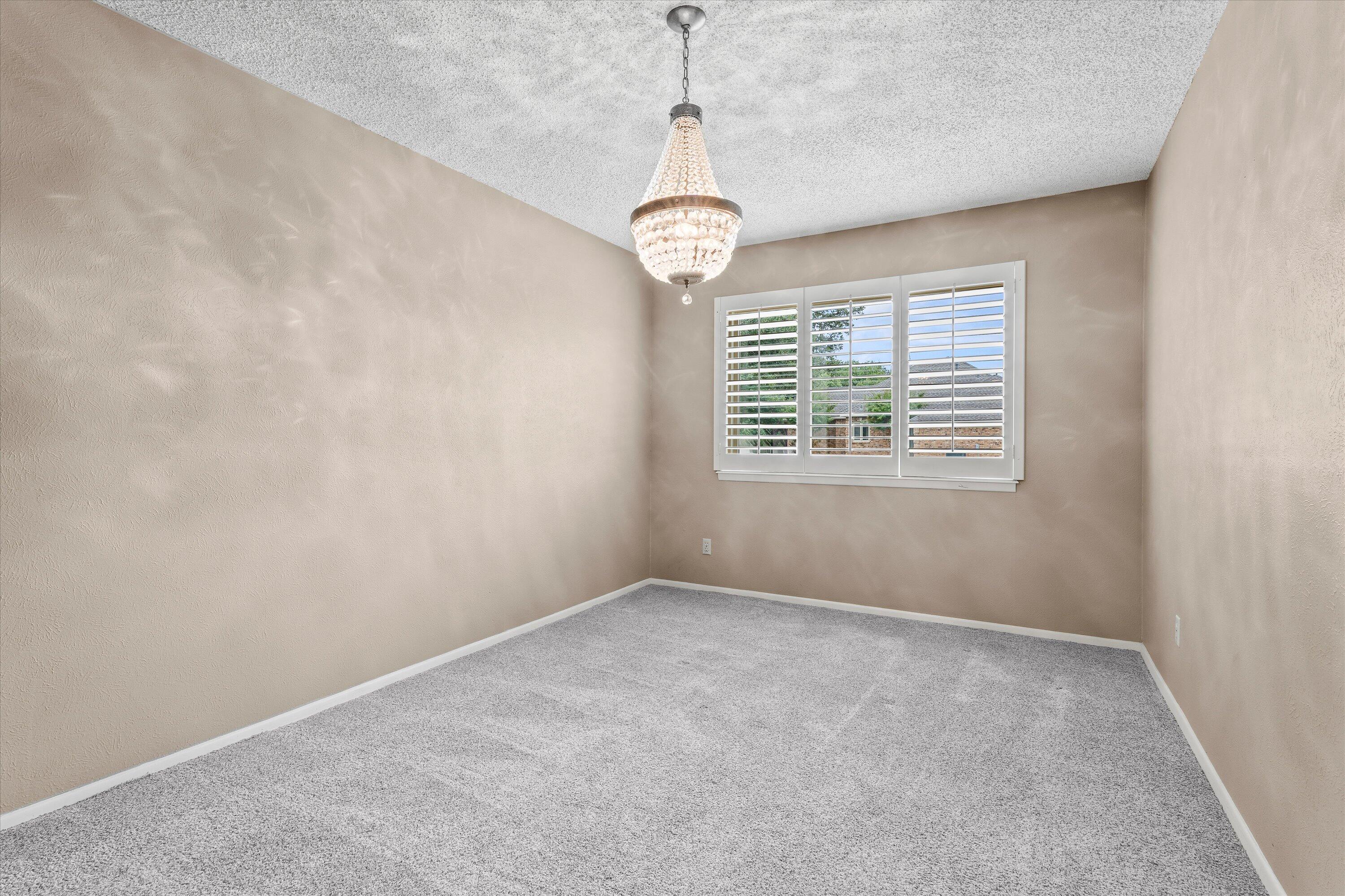 103 Baylor Lane Levelland, TX 79336 - Photo 9 of 27 a view of an empty room with windows