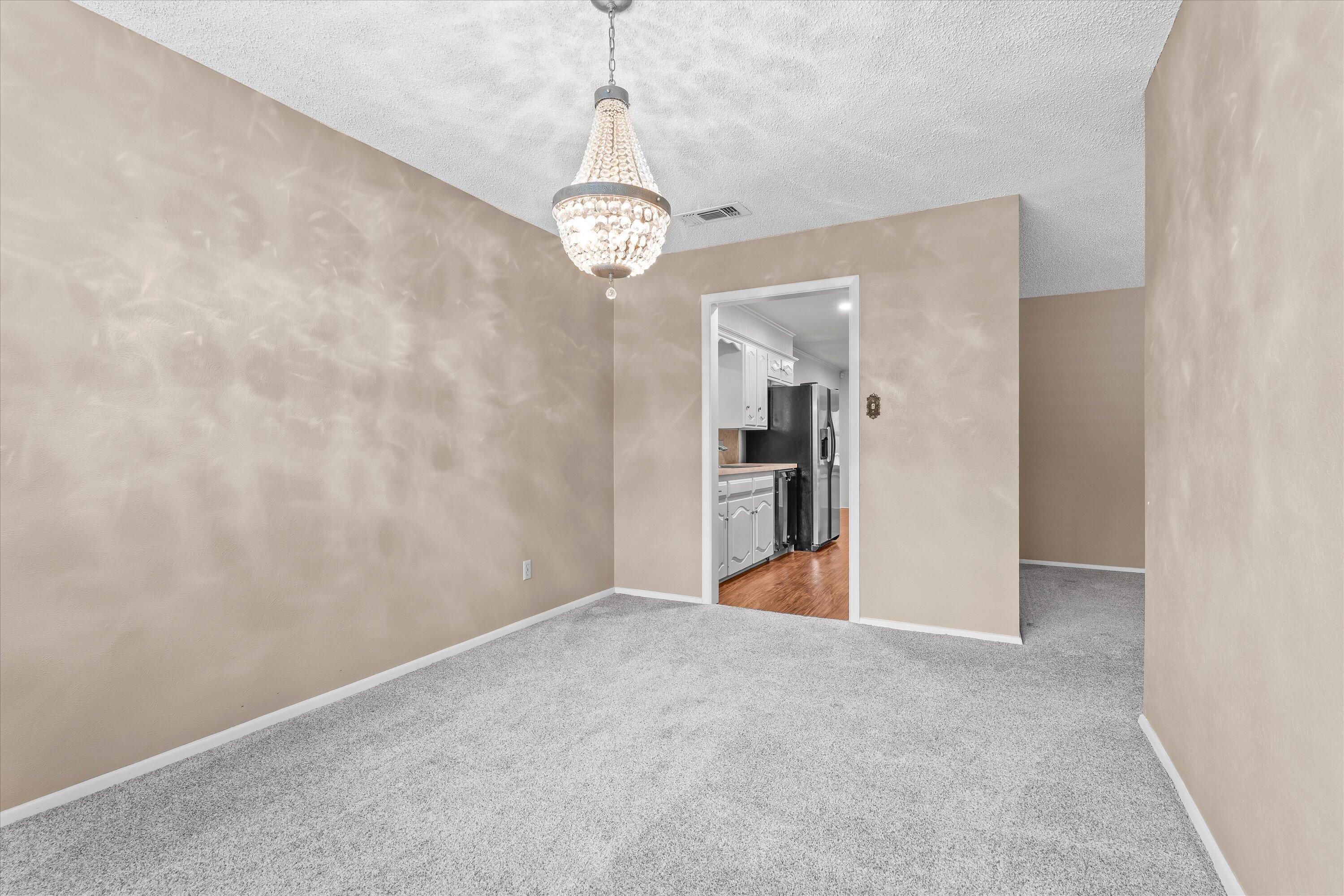 103 Baylor Lane Levelland, TX 79336 - Photo 10 of 27 a view of an empty room with a window
