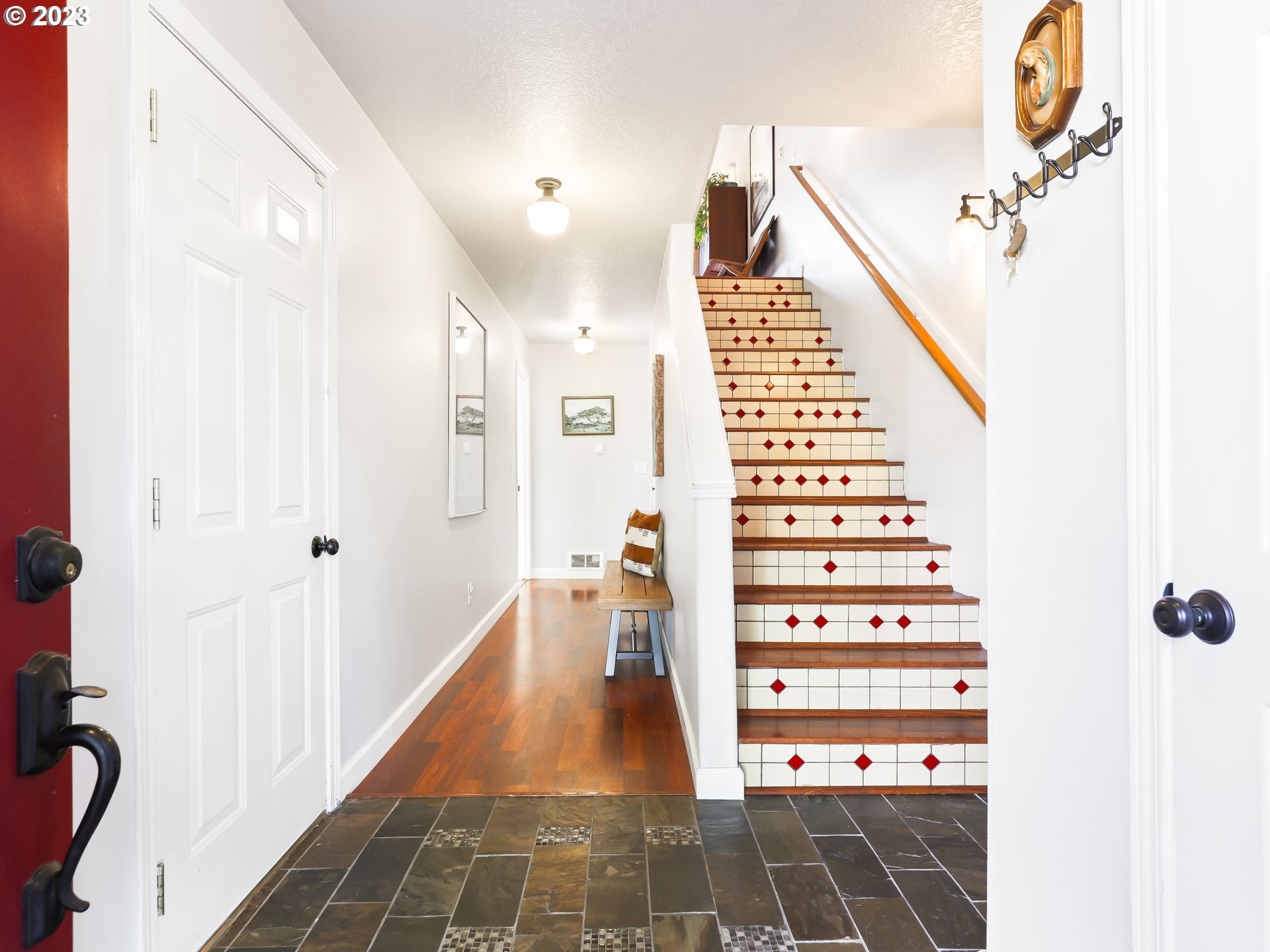 15820 Northeast Beech Street Portland, OR 97230 - Photo 2 of 28 a view of a hallway with wooden floor and staircase