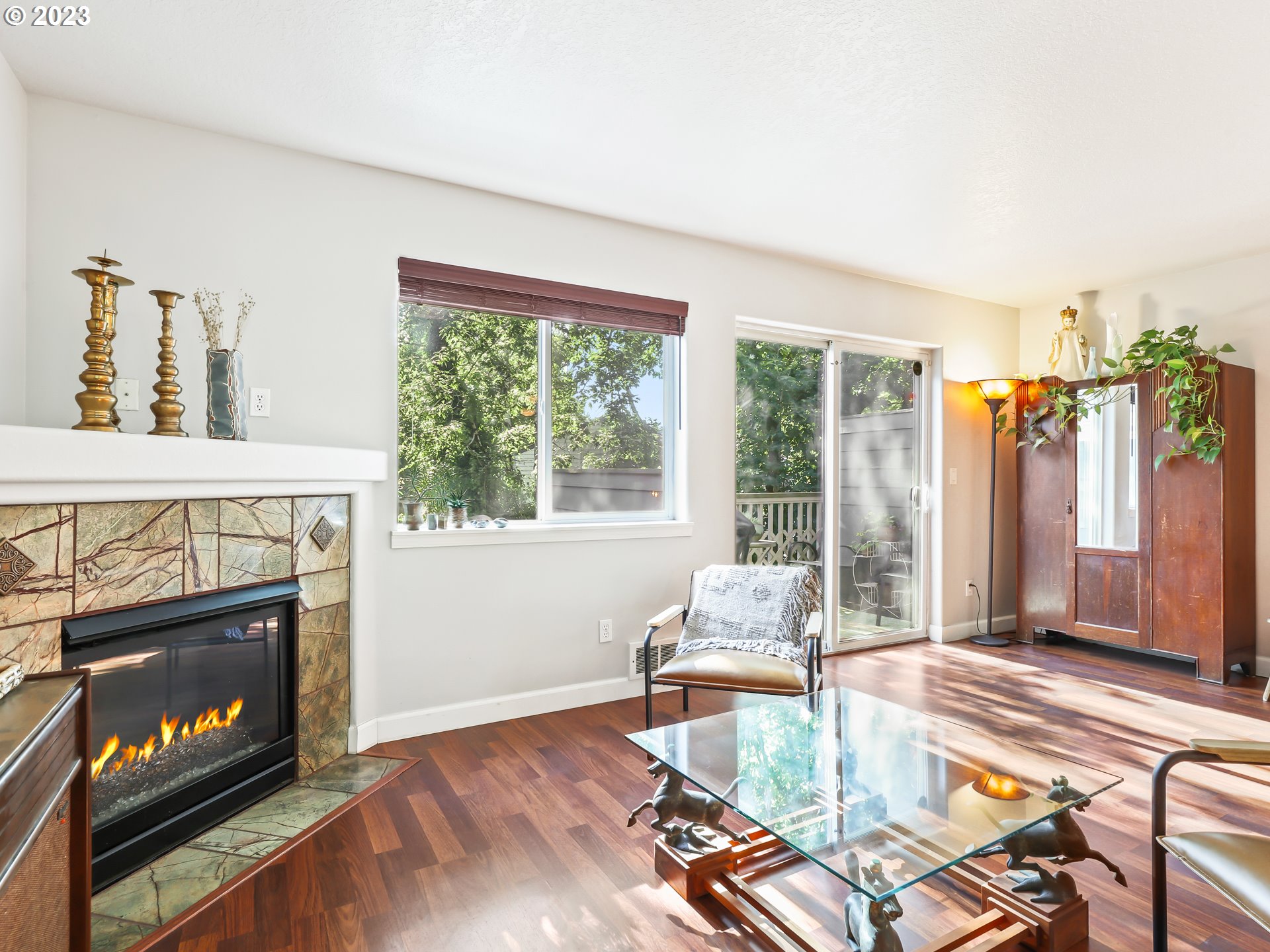 15820 Northeast Beech Street Portland, OR 97230 - Photo 3 of 28 a living room with furniture large window and a fireplace