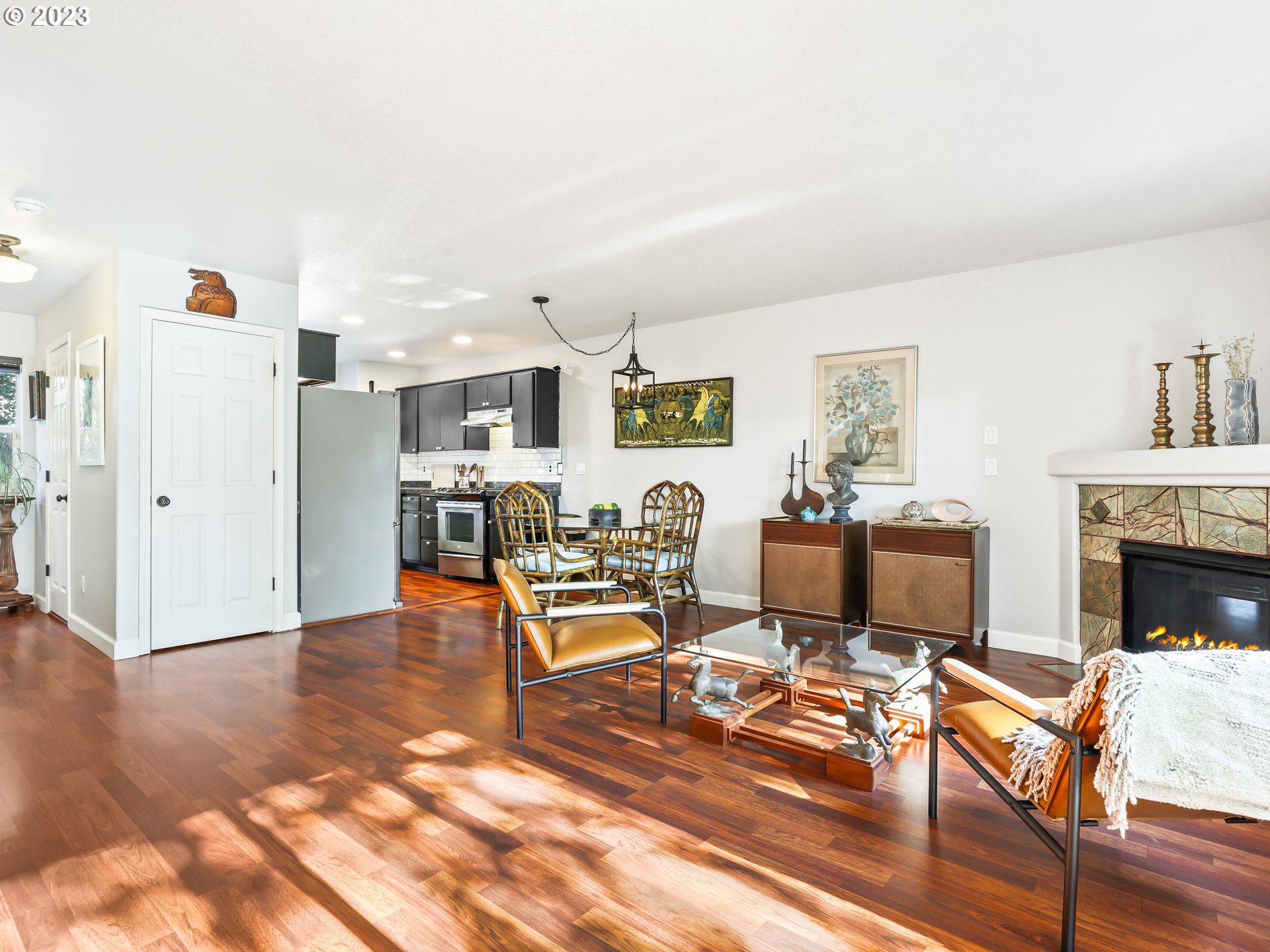 15820 Northeast Beech Street Portland, OR 97230 - Photo 5 of 28 a living room with furniture and a fireplace