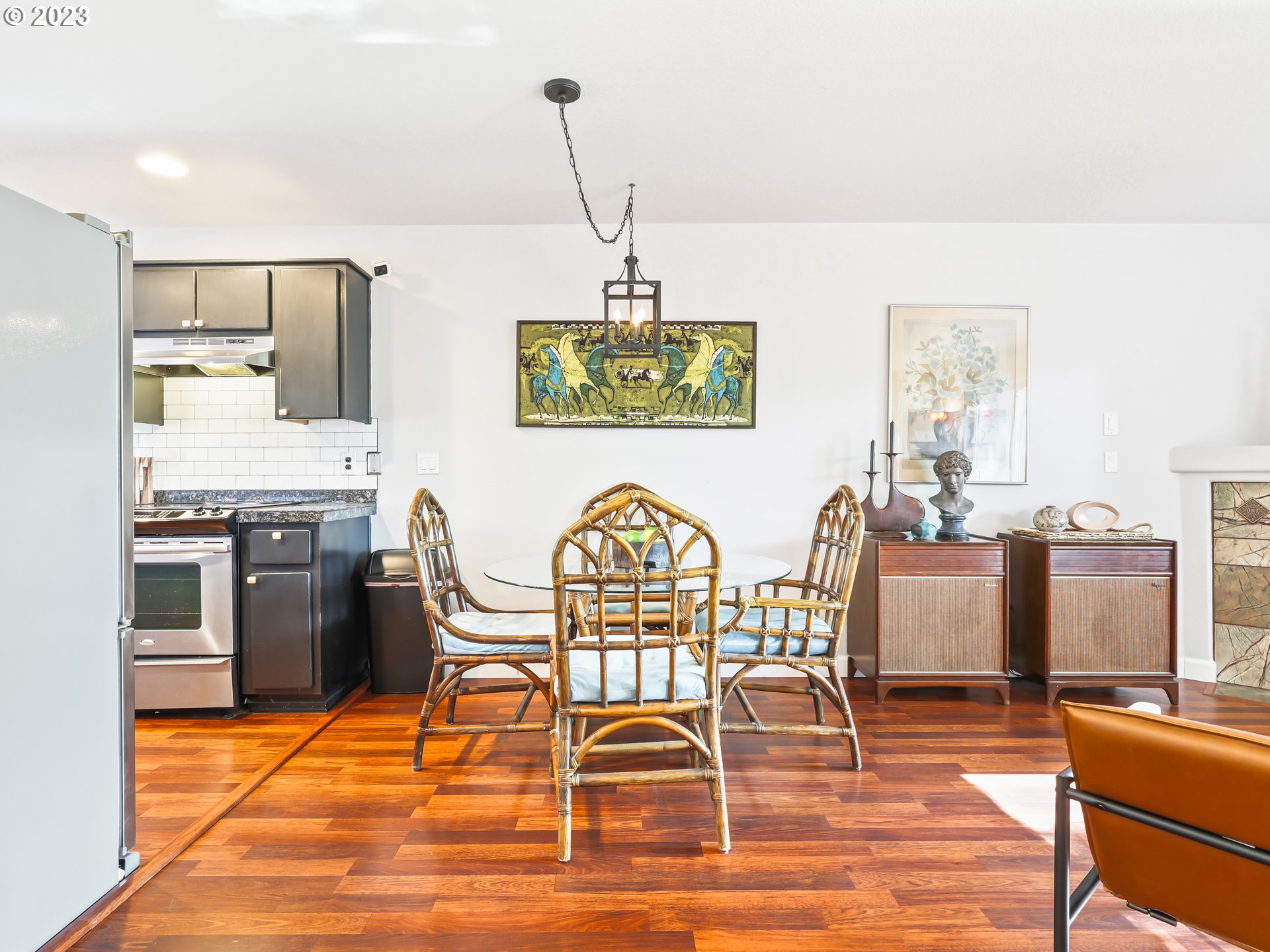 15820 Northeast Beech Street Portland, OR 97230 - Photo 6 of 28 a view of a dining room with furniture a chandelier and wooden floor